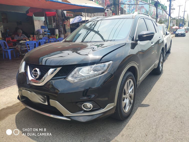 Chiếc ô tô Nissan Xtrail của Cty TNHH Tư vấn đầu tư Toàn Cầu